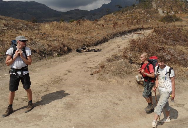 Eerik (blond) is pleased to reach the plateau as is David. Matthew seems to be half waiting and half 'let's get on to the cottage'.